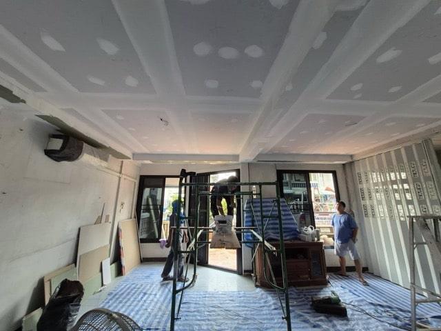 Professional exterior ceiling installation team working on tropical weather-resistant ceiling in Koh Samui