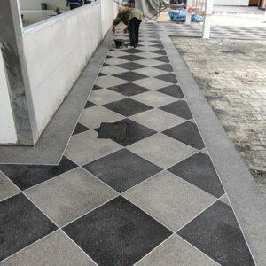 Close-up detail of high-quality washed stone aggregate flooring with natural stone colors and textures