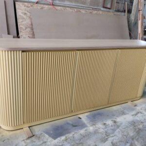 Custom teak wood counter installation in modern Koh Samui villa kitchen