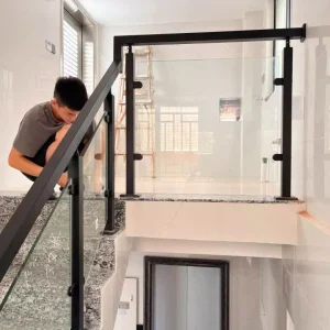 Frameless glass railing installation on luxury villa balcony in Koh Samui with ocean views