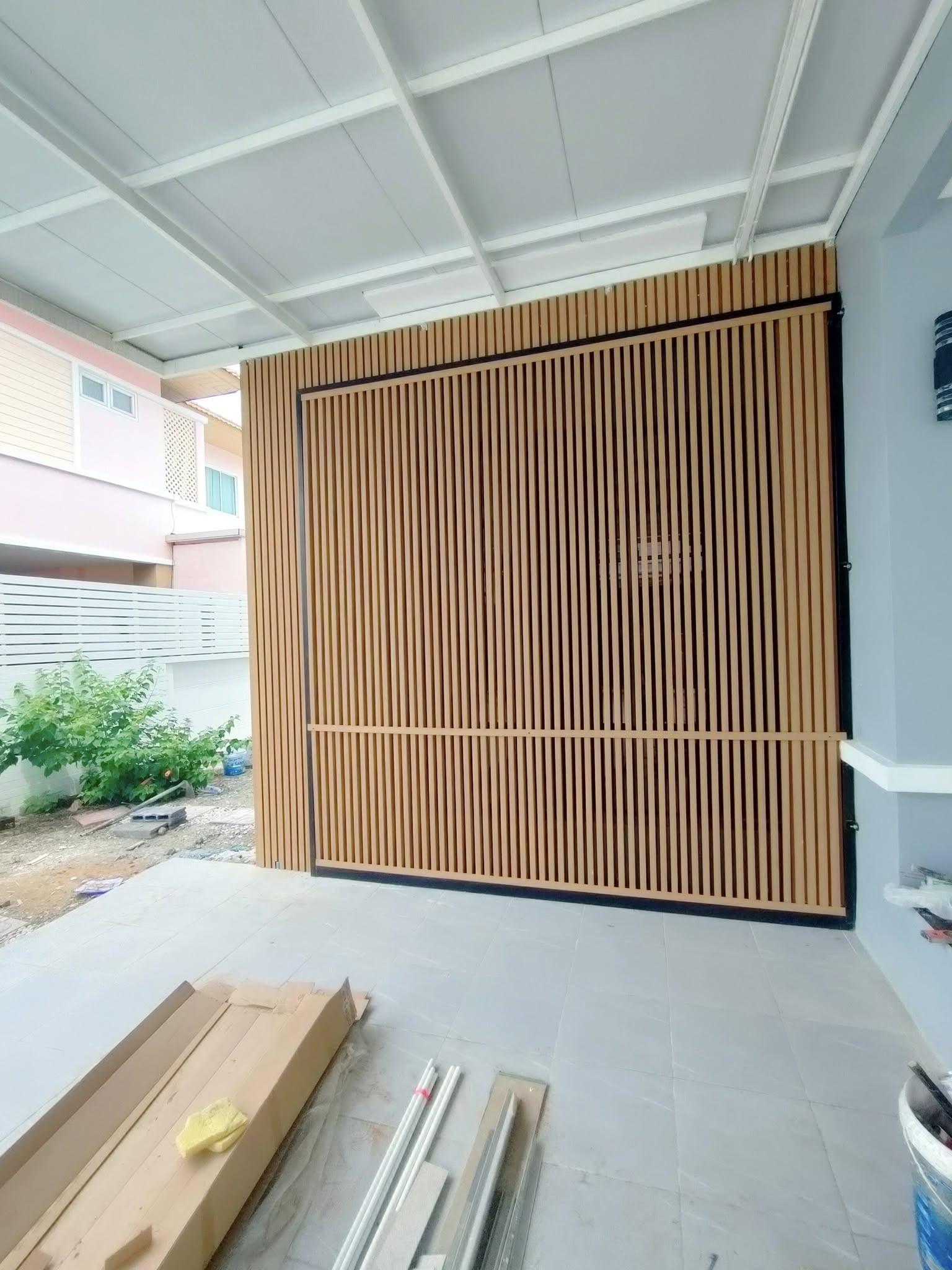 Close-up of high-quality WPC exterior cladding with realistic wood grain finish
