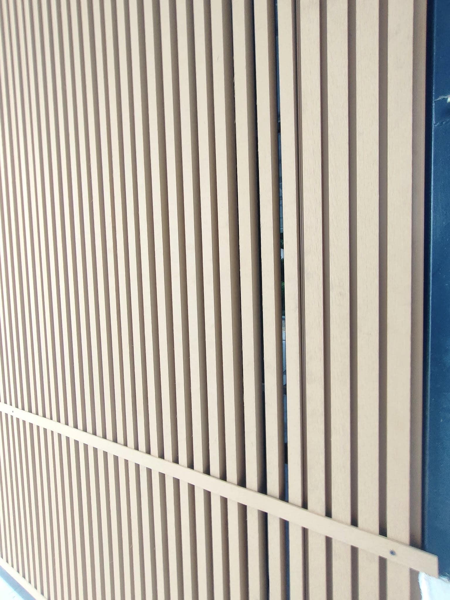 Close-up of high-quality WPC exterior cladding with realistic wood grain finish