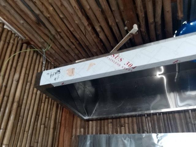 Commercial range hood installation in Samui restaurant kitchen
