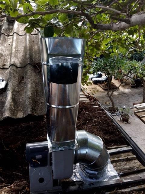 Expert technician installing kitchen exhaust hood in Samui home